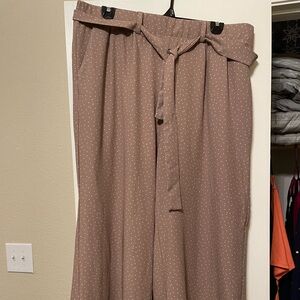 Torrid mauve and white polka dot wide leg pant.